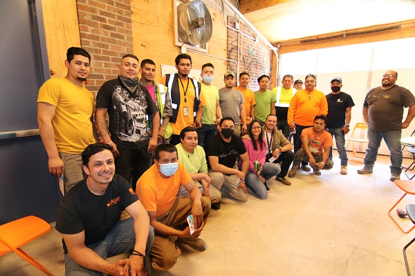 Group of clients sitting and standing, some with masks