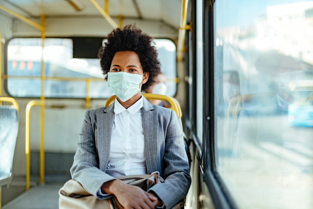 African,American,Businesswoman,Wearing,Protective,Mask,While,Traveling,By,Public