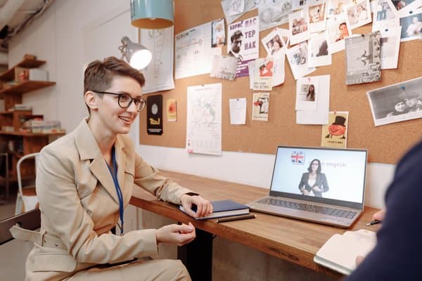 Woman at a laptop during an English language lesson