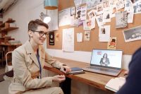 Woman at a laptop during an English language lesson